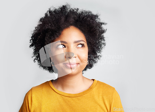 Image of Thinking, curious and African woman in studio with idea, decision or choice against grey background. Idea, contemplation and female choosing, unsure and wondering, deciding and ponder while isolated