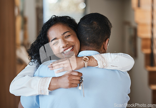 Image of House keys, new home or happy couple hugging for real estate, property investment or apartment success. Dream, love or Indian man embracing an excited woman to celebrate goals or moving in together