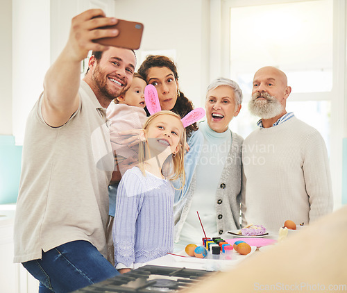 Image of Easter selfie, big family and smile while painting, holiday bonding and memory together at home. Happy, festive and a father taking a photo with children, mother and senior parents with an activity