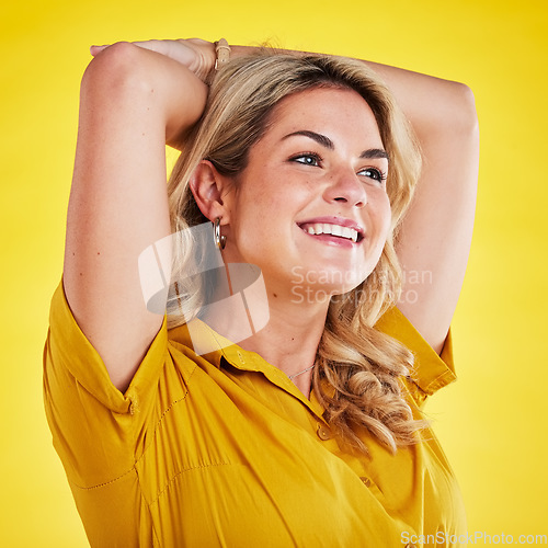 Image of Happy woman, studio and yellow background of a model with a smile and feeling carefree. Relax, isolated and young female person with youth, style and happiness in trendy fashion clothes