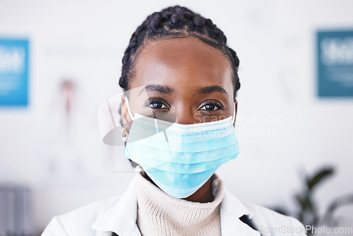Image of Doctor, portrait and covid mask on woman for healthcare, medical help and safety compliance in hospital. Face of professional African person with ppe health, wellness and medicine support in clinic