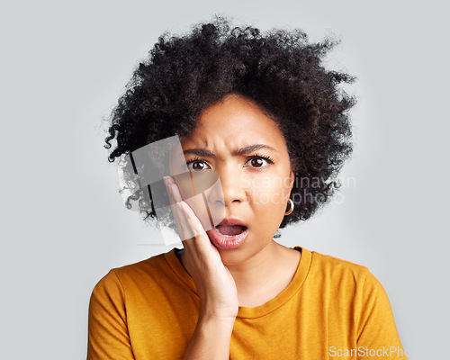 Image of Omg, wow and confused woman with hand on face in studio confused, surprised and open mouth on grey background. Wtf, portrait and African female shocked, by news, gossip or rumor, drama or secret