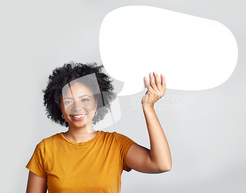 Image of Speech bubble, portrait and happy woman in studio with mockup, message and space on grey background. Banner, poster and African female with social media, news or announcement on isolated billboard