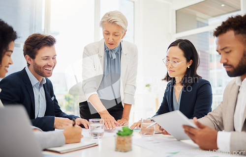 Image of Collaboration, meeting and a manager business woman talking to her team in the boardroom for coaching. Teamwork, leadership and planning with an employee group in the office for a strategy workshop