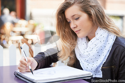 Image of Drawing, art or woman with a notebook on campus for school creativity, working or learning in college. Artistic or girl student writing or sketching a face on paper for education or university class