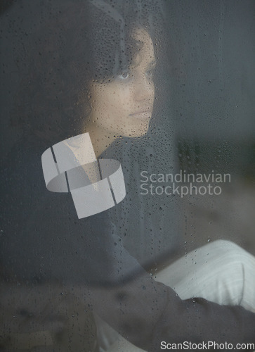 Image of Sad, rain and thinking with woman by window for depression, tired and lonely. Anxiety, mental health and exhausted with female contemplating at home for broken heart, disappointed and fear mockup