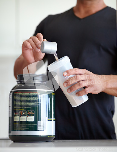 Image of Man, hands and preparing whey protein shake for nutrition, muscle gain or body mass supplement. Hand of male bodybuilder making pre workout or powder drink product for exercise, diet or healthy meal