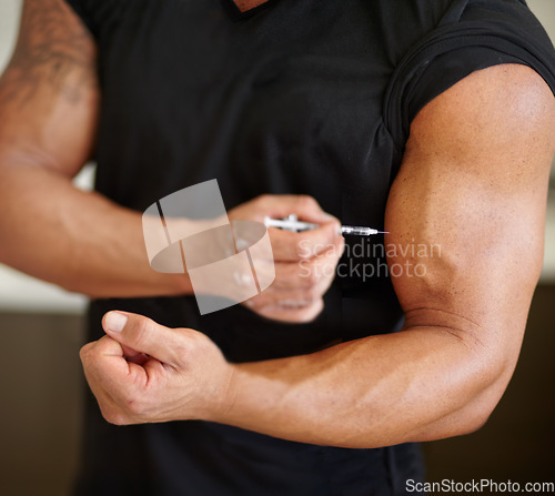 Image of Arm, steroids and syringe with a bodybuilder man using a needle for a bicep muscle injection closeup. Fitness, health and testosterone with a male athlete or sports person injecting illegal substance