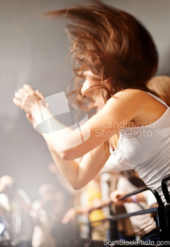 Image of Dance, woman in fence row and music festival, fan watching rock concert or live event on stage. Girl dancing in crowd, excited fans at band performance and head banging in arena or stadium at show