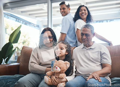 Image of Big family, house and sofa with grandparents, kid smile and happiness in a living room lounge. Happy, love and parent care of a mom, dad and child with elderly people relax on a couch in a home