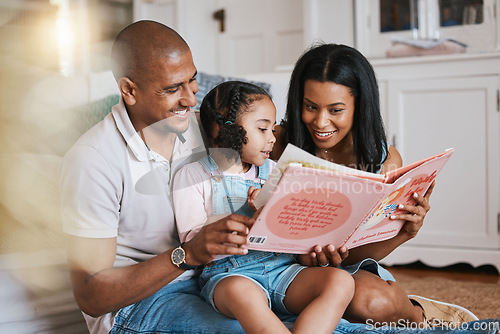 Image of Love, bonding and family reading a book together before bed in a bedroom in the modern house. Happy, smile and girl kid enjoying a fantasy novel or story with her mother and father in their home.