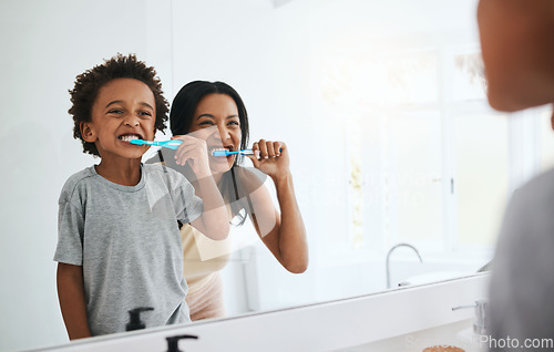 Image of Learning, mother and son brushing teeth, dental hygiene and wellness at home, bathroom and bonding. Family, female parent or mama with male child, kid or boy with oral health, cleaning mouth or smile