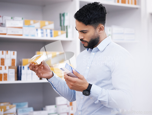 Image of Pharmacy, medicine and man with pills reading label for medication, prescription and treatment. Healthcare clinic, drug store and male person with box for medical product, supplements and antibiotics