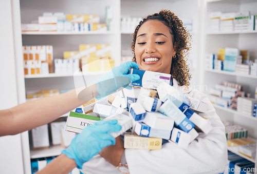 Image of Pills, stock stress and woman pharmacist with medicine box, retail and supplements in a pharmacy with chaos. Healthcare, wellness and shop worker doing inventory for medication sales with anxiety