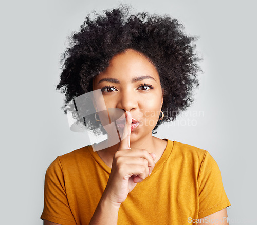Image of Portrait, woman and secret with finger on lips for privacy, mystery and noise on white background. Face of female model, silence and shush for quiet, gossip or whisper emoji of confidential surprise
