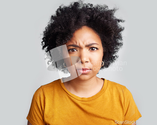 Image of Confused, portrait and woman in studio, pensive and unsure against a grey background. Doubt, annoyed and face of African female with dont know frown, attitude and angry, doubtful and frustrated