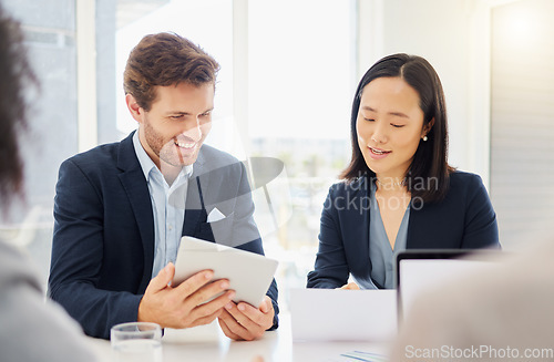 Image of Business people, meeting conversation and tablet ideas together in an office. Asian woman employee reading a report review with a businessman while talking and planning a company strategy with data