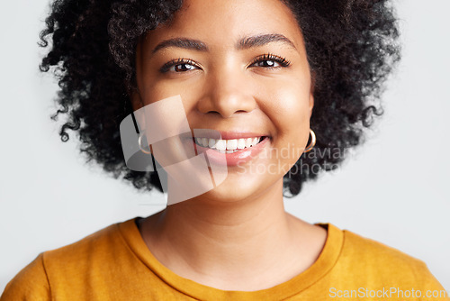 Image of Happy, woman and portrait of face in studio, white background and backdrop. Confident young african female model smile for natural curly afro hair, positive personality and gen z girl of South Africa