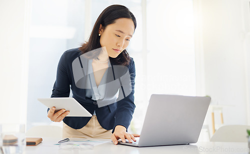 Image of Tablet, focus and laptop with business woman in office for planning, online report and email. Technology, communication and connection with asian female employee for corporate, idea and review