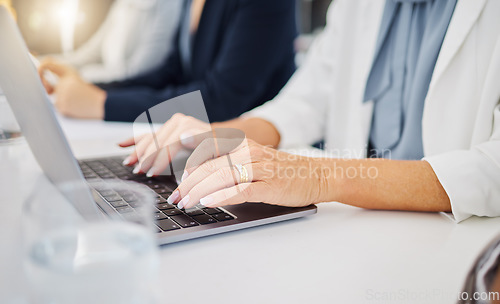 Image of Laptop, hands of business woman in office for research, planning and email. Website, online report and technology with closeup of female employee typing in meeting for idea, internet and digital