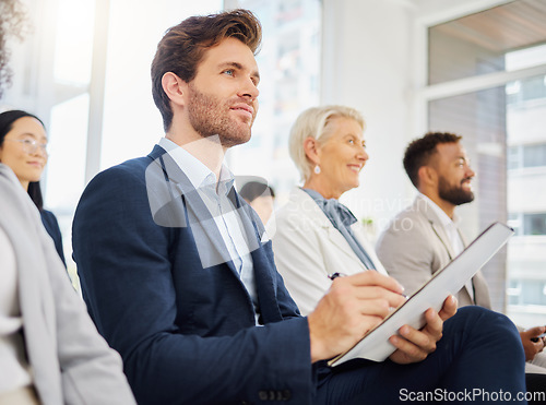 Image of Audience, notebook and happy man writing notes of tradeshow speech, seminar presentation or convention event. Trade show attention, conference meeting or business crowd listening in training workshop