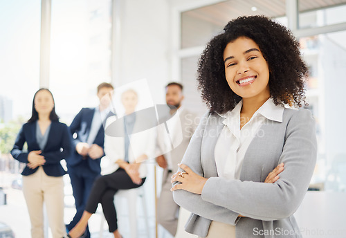 Image of Business, happy and portrait of African woman in office with confidence, pride and crossed arms. Corporate, professional and female worker smile with team for success, company mission and leadership