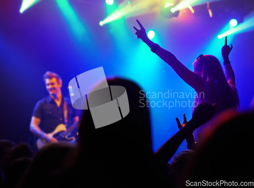 Image of Audience, neon lights or people dancing at music festival from back, lighting at live concert night event. Dance, fun or group of excited fans in arena at rock band performance or crowd at party