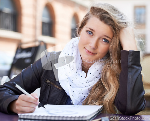 Image of Creative, portrait and student drawing in the city on a notepad for an art college assignment. Happy, smile and young female artist sketching a picture in a book for university project in urban town.