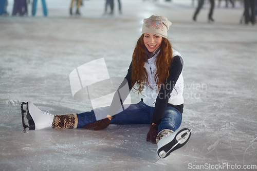 Image of Woman, ice skater and sitting in portrait with smile for workout, training and exercise for winter sports. Girl, skating rink and happiness for sport, skate or fitness with excited face for lifestyle