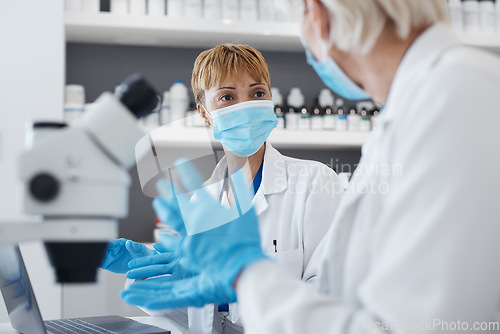 Image of Science women, talking and research in a laboratory for scientist investigation or collaboration. Expert medical team in lab with equipment for innovation, future medicine or biotechnology study