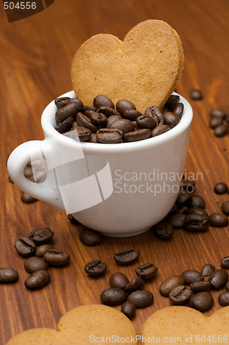 Image of Three Gingerbread Cookies in Coffee Beans