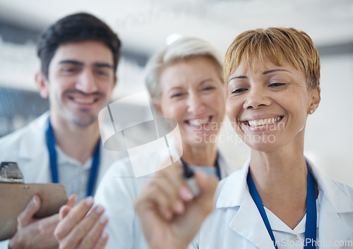 Image of Doctor, happy team and writing healthcare strategy for schedule planning or brainstorming together at hospital. Group of doctors smile in meeting, collaboration or teamwork for medical tasks or plan