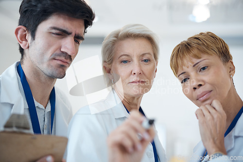 Image of Doctor, serious team and thinking in strategy or healthcare for schedule planning or brainstorming ideas at hospital. Group of thoughtful doctors in teamwork collaboration contemplating medical plan