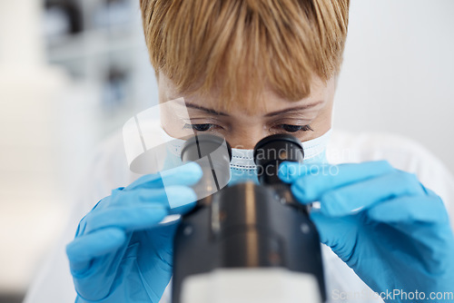Image of Woman, science microscope and medical analysis in a laboratory for investigation or research. Scientist person in a lab with a face mask for future medicine, biotechnology innovation or development