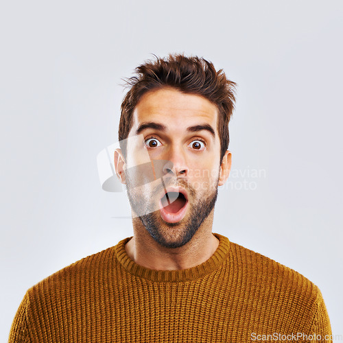 Image of Shock, surprise and portrait of a man in a studio with an amazed facial expression or attitude. Shocked, amazing news and male model with a wtf, omg or wow face gesture isolated. by white background.