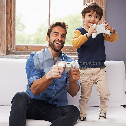 Image of Love, father and son on a couch, online game and relax at home, playing or carefree in the lounge. Family, dad or boy with parent, kid or male child with controller, gamers or bonding with connection