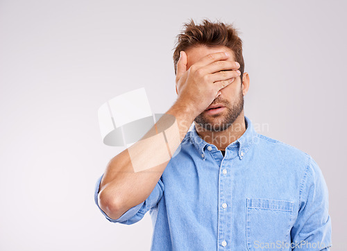 Image of Mockup, covering eyes and man with regret, mistake and guy against a grey studio background. Male person, model or human with hand on face, frustrated and problem with an issue, upset or disappointed