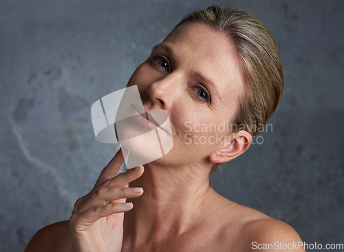 Image of Portrait, smile and senior woman with skincare, cosmetics and beauty on a studio background. Face detox, mature female person and elderly human with dermatology, grooming and treatment with soft skin