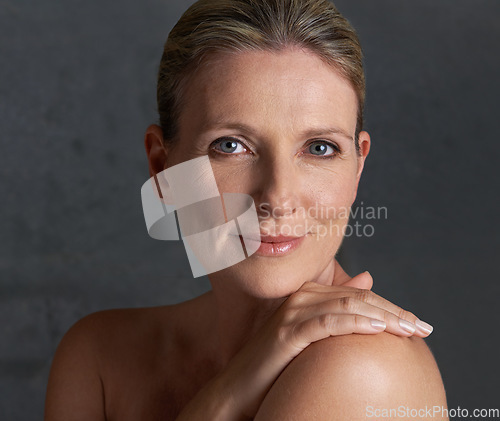 Image of Portrait, skincare and senior woman with cosmetics, beauty and dermatology against studio background. Face, mature female person and old lady with salon treatment, hygiene and grooming with soft skin