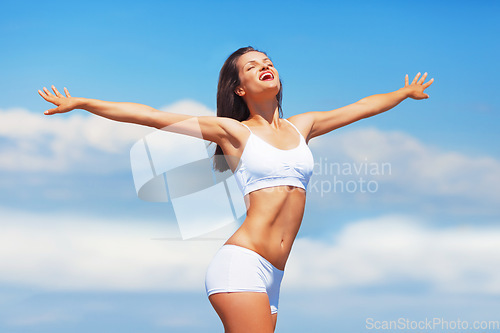 Image of Fitness, sky and woman stretching arms in underwear with smile, freedom and achievement of health goals. Mockup, happiness and sports model with energy, healthy mindset and celebration in fresh air.