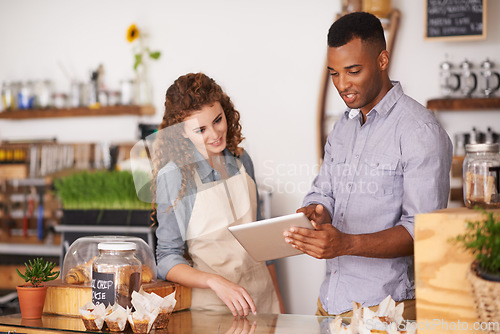 Image of Tablet, cafe owner and teamwork of people talking, discussion and manage orders. Waiters, black man and woman in restaurant with technology for inventory, stock check and managing sales in store.