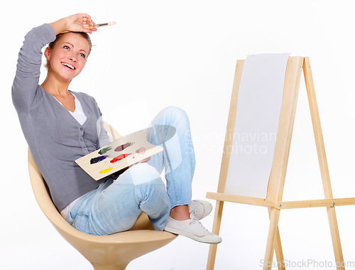 Image of Woman, painting and happy with art canvas in studio for creativity and talent with paint brush for color. Female artist or painter isolated on a white background for creative work and mockup idea