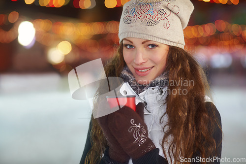 Image of Portrait, winter and woman with a coffee, smile and relax with cold, warmth and chilling. Face, female person and happy model with tea, blurry background and happiness with cappuccino and joyful