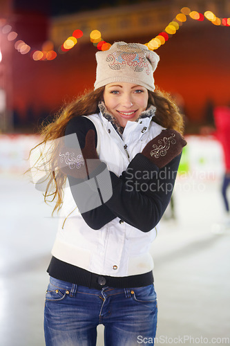 Image of Woman, ice rink portrait and night with smile in cold for workout, training or exercise on winter holiday. Girl, skate and happy for sports, outdoor and freezing for fun with excited face on vacation