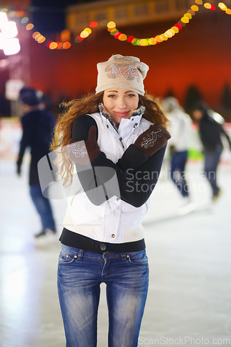 Image of Woman, ice rink and portrait on cold night with self hug, training and exercise on winter holiday. Young girl, skate and freezing body with warm clothes for mistake, outdoor and regret on vacation