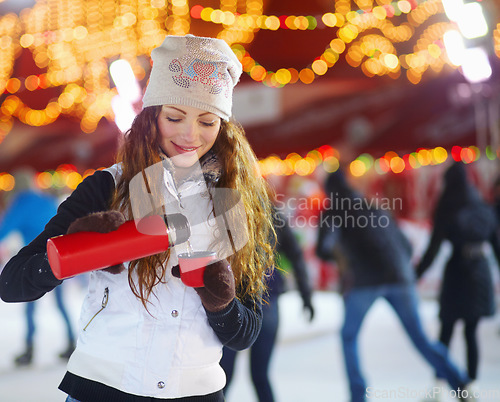 Image of Outdoor, winter and woman with coffee, smile and cold with beverage, thermos and snow. Female person, girl and model with a flask, outside and happiness with tea, cocoa and fun with frosty weather