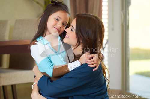 Image of Mom, child hug and portrait with a smile in family home with love, parent support and happiness. House, mama care and young girl with happy mother together in a living room bonding while hugging