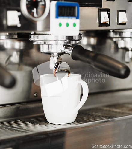 Image of Pouring coffee, cup and machine in cafe for cappuccino, latte beverage or hot drink. Restaurant, electrical appliance and caffeine mug for making or brewing espresso in retail shop or small business.