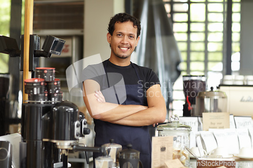 Image of Coffee shop, barista and portrait of a man as small business, restaurant or startup owner with pride. Smile of a happy entrepreneur man working as a waiter or manager in a cafeteria, cafe or store