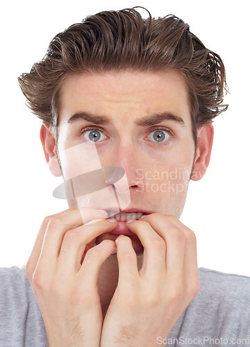 Image of Stress, anxiety and portrait of a man with worry and fear in a studio biting nails. Isolated, white background and male model face with terror, shock and afraid feeling nervous and anxious with panic